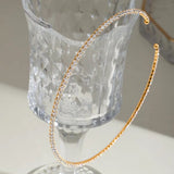 18K Gold Plated Square Tennis Choker placed on a table for a photo