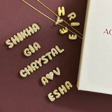 Small Bubble Initial Name Necklace placed with the letters arranged