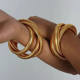 Statement Snake Chain Coil Bracelet wore on both hands