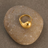 18k Gold Plated Luna Ring placed on a stone