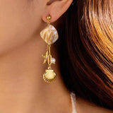 18K Gold Plated Ocean Dreams Danglers wore left earring